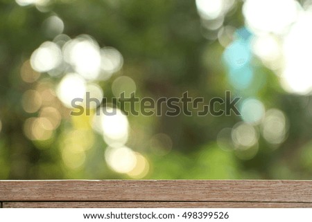 wood table with green background.
