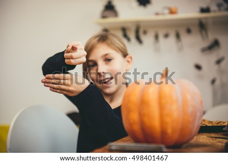 Girl doing magic tricks for halloween
