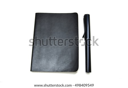 black notebook and black pen with white background