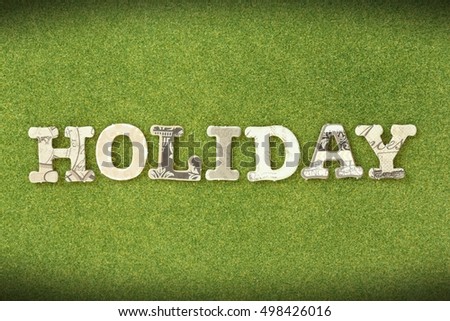  holiday:paper cut alphabet on green grass