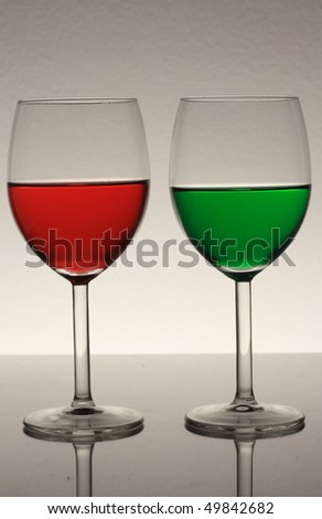 concept of stop or continue drinking with red and green wine