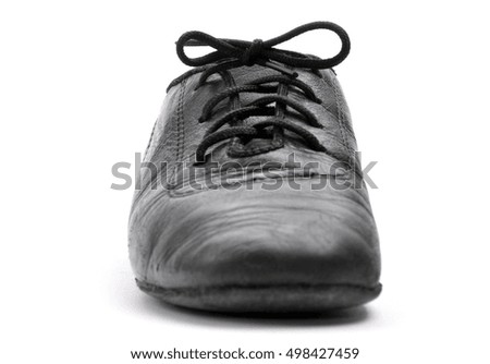 Lacing on a black leather ballroom shoe on white background