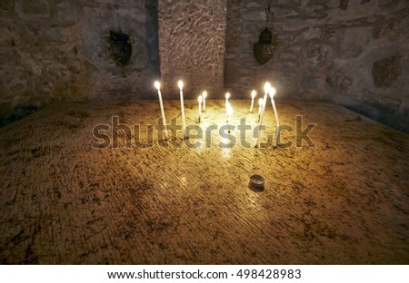Inside the holy sepulcher at Jerusalem - Israel. Light a candle