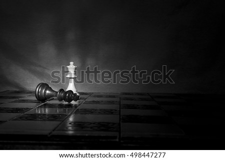 Chess photographed on a chessboard Royalty-Free Stock Photo #498447277