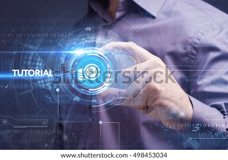 Business, Technology, Internet and network concept. Young businessman working on a virtual screen of the future and sees the inscription: tutorial