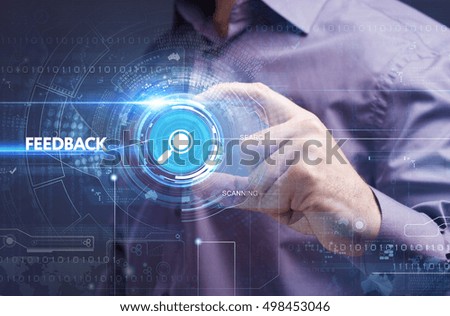 Business, Technology, Internet and network concept. Young businessman working on a virtual screen of the future and sees the inscription: feedback