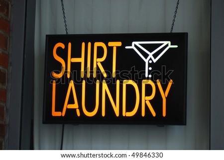 A neon sign of the shirt laundry shop