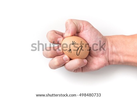 Hand squeeze egg with painful face on white background for emotional concept