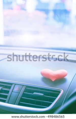 Inside the car with Pink heart with light filter