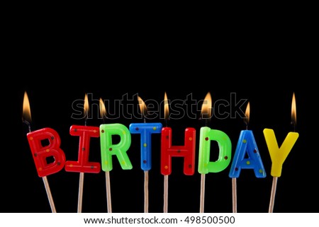 happy birthday candles on black background
