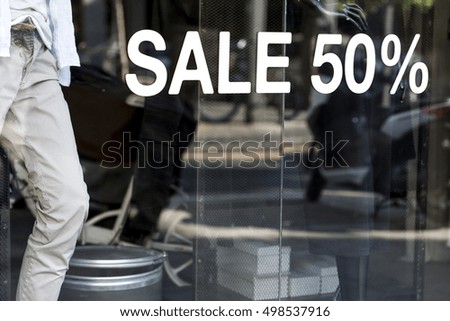Store window with a SALE notice on it