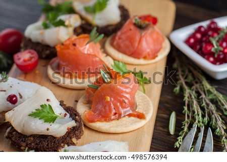 Assorted canape fresh smoked fish on board