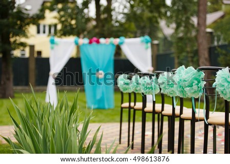 Wedding set up in a garden. Wedding ceremony & Wedding decorations/Wedding Archway/Wedding Archway with aqua and pink colors. 