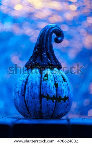 Halloween Celebration Background With Glitter Pumpkin Glowing. Vertical Selective Focus Close Up With Copy Space. Blue Color Tone Filter Applied.