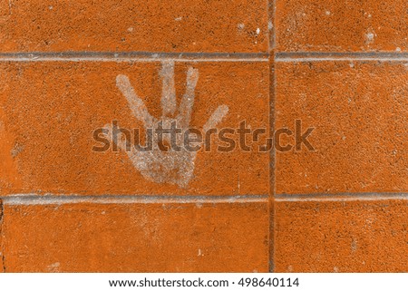 Fingerprint on the wall in the city, hand stamp on wall , vintage style