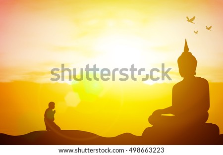 Silhouette people pray from buddha statue to hope for help on sun set and bokeh background. Inspiration from help to hope for Vesak Day or Wesak, Jayanti day or Visakha Bucha day