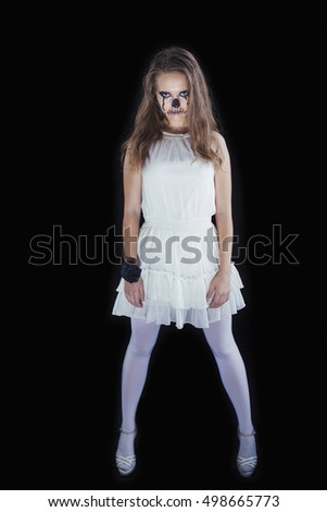Make-up for the celebration of Halloween, the girl in a white dress on a black background