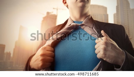 Superman under a business suit Royalty-Free Stock Photo #498711685