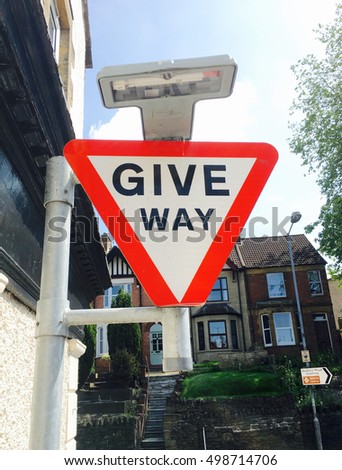 Give way sign for motorists on a side of a road