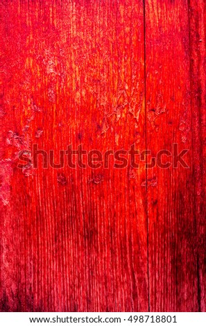 red bloody burgundy metal plate with cracked paint and big paint spots because of time as background, metal wall with rusty spots and cracked paint as texture, toned to color, high quality resolution