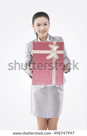 Asian business woman with gift box