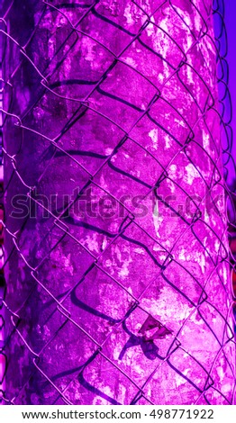 violet grid shadow on cement vintage pylon, shadow from netting against violet pylon, netting shadow as texture, high quality resolution