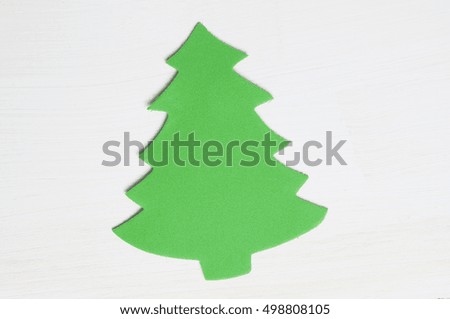 green foam christmas tree on a white wooden background