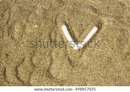  writing with  letter  made of  sand isolated  white inside 