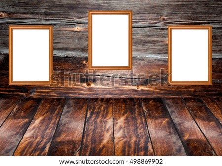 three frames on the wooden old wall interior