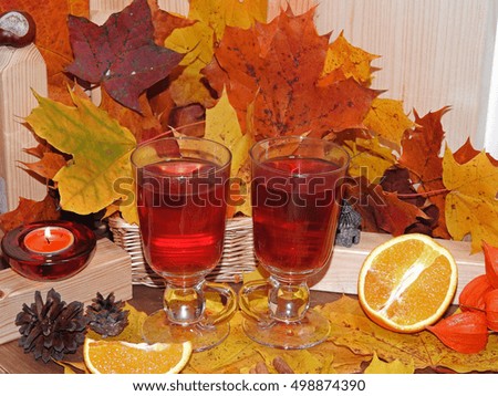 Autumn composition, cup of red tea on a background of autumn
