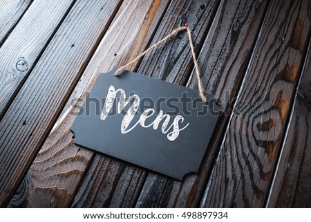 Mens Sign Written In Chalk On Chalkboard On Rustic Vintage Wood Background. Selective Focus.