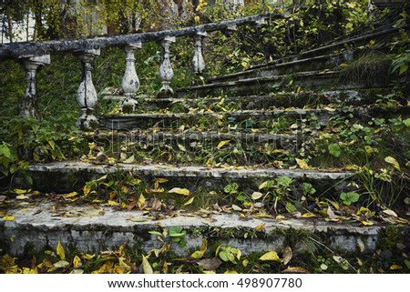 old abandoned staircase leading to the house with ghosts. Vintage beautiful staircase with handrails