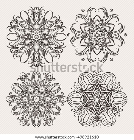 Set of ornate vector mandala symbols. Mehndi lace tattoo. Art Nouveau weave. The circular pattern.