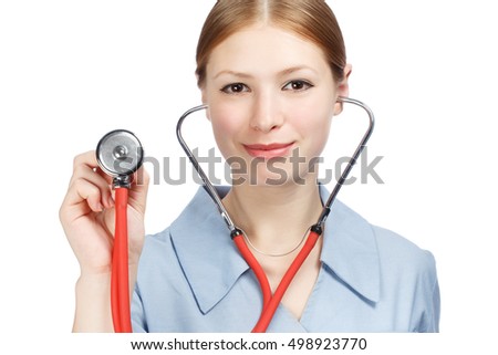Young beautiful smiling woman in blue doctor's smock holding red stethoscope in hands in listening gesture isolated on white background.