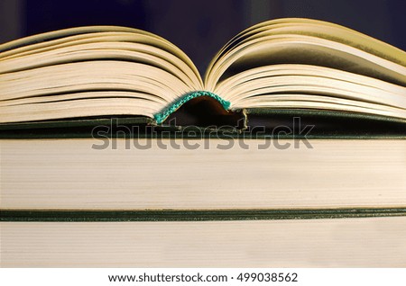 Open  book resting on book