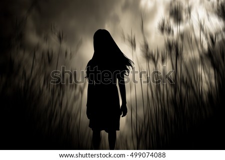 Girl walking in the woods,Horror Background For Halloween Concept And Movie Poster Project