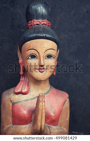 Wooden statue with praying hands or traditional of Thai greeting referred to as the "wai"