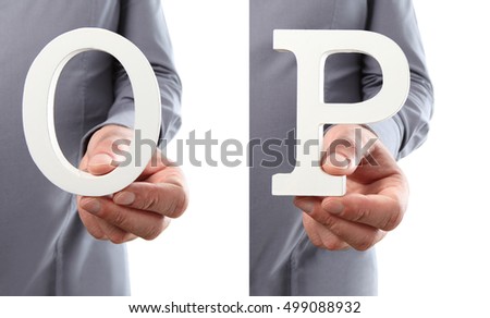 Hands holding letter O and P from alphabet isolated on a white background
