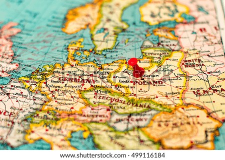 Warsaw, Poland pinned on vintage map of Europe