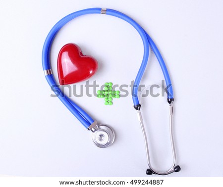 Green medical cross sign stethoscope red heart.