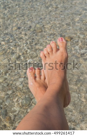 Female feet relaxing on the beach,Orebic,peninsula Peljesac