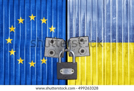 EU and Ukraine flag on door with padlock