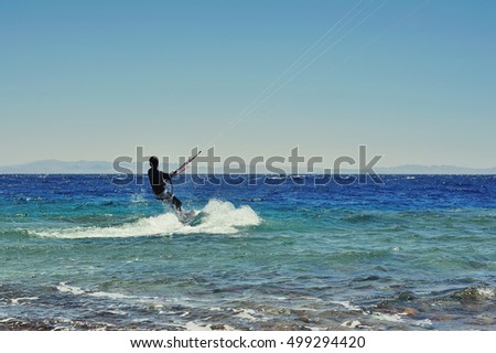 riding on kite surf board on Red Sea, Dahab