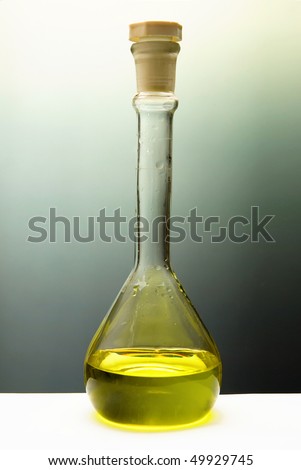 Photo of weighing bottle with lid with red and yellow solution.