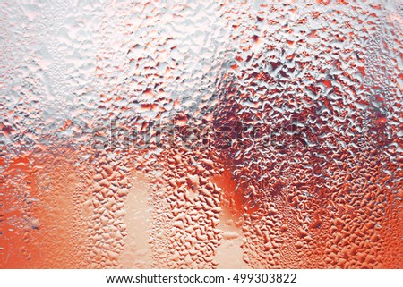 Rain drops on glass.Droplets on freshly poured beer