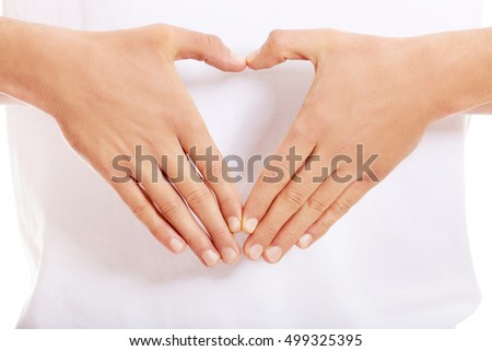 Young man doing heart gesture