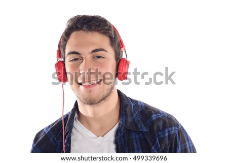 Portrait of young latin man listening to music. Isolated white background.