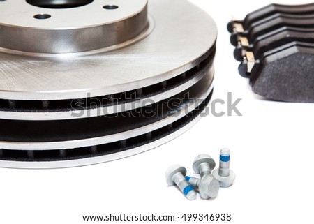 Set of brake disks and brake pads for front wheels of car, isolated on white background