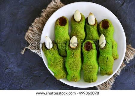 Witch finger cookies on bokeh background, selective focus
