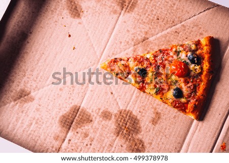 pieces of pizza with  olives, cheese and salami sausage